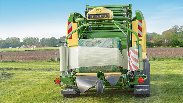 Efficient and reliable bale wrapping